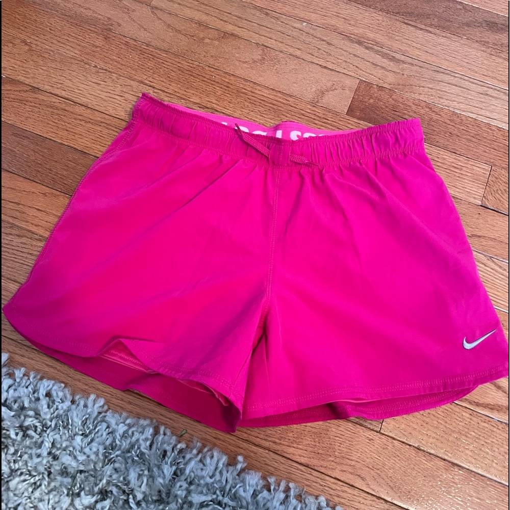 Bright pink Nike shorts
